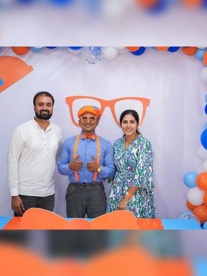 The happy parents with our Blippi entertainer. It's wonderful to see them enjoying the party as much as their kids.