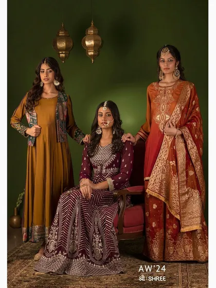 A group portrait for the SHREE Autumn Winter '24 collection. This shot was composed to feel like a classic painting, highlighting the rich colors and textures of the ethnic wear in a formal, elegant setting.
