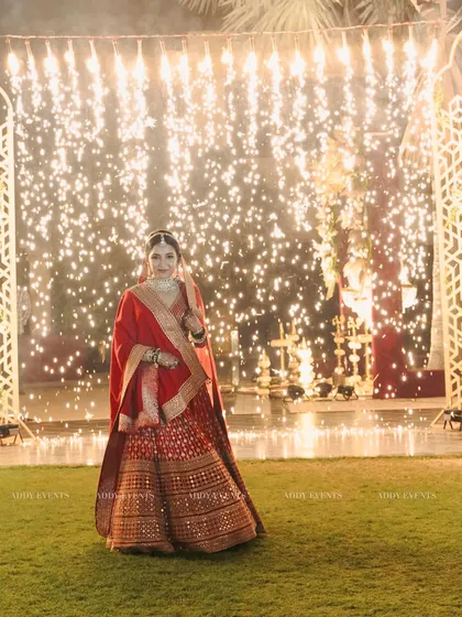 The bride stands radiant against a wall of cold pyro sparks, a moment of pure glamour and celebration that we expertly stage and capture.