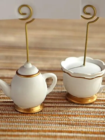 A detailed view of my teapot and teacup place card holders. The white ceramic with delicate gold trim makes them a perfect match for elegant tea parties or bridal brunches.