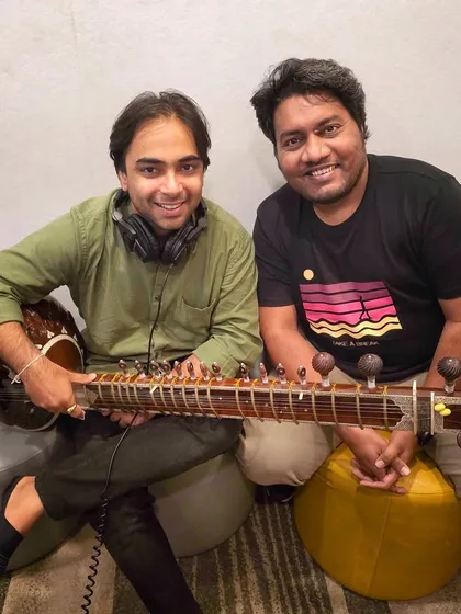 In the studio recording a sitar piece for a Visa ad film with composer Santosh Jagdale. I am experienced in delivering professional, high-quality tracks for major brands and advertising campaigns.