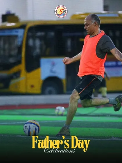 A dad shows his skills on the ball during the Father's Day match.