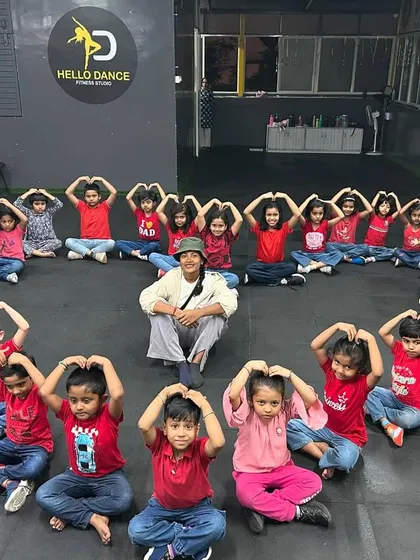 An instructor at the heart of it all! We believe in building strong, positive relationships with our students. This picture shows one of our instructors surrounded by the love and energy of our amazing kids' batch.
