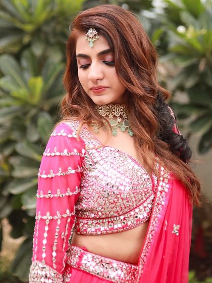 A close-up of the eye makeup, featuring a beautiful blend of pink and gold shimmers.