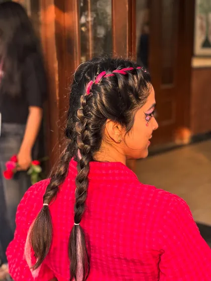 It's not just about faces. Our festival hair glam, featuring colorful temporary braids and extensions, is a huge hit. This look adds an instant pop of fun and transforms your entire vibe in minutes.