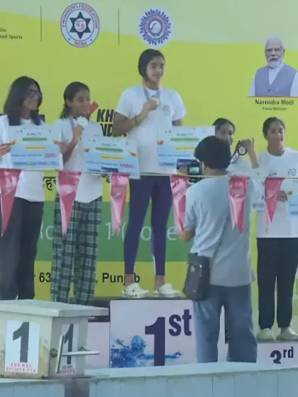 Lakshita Singh on the podium at the Asmita Khelo India Women's Swimming League, where she won an impressive four gold medals and a cash prize.