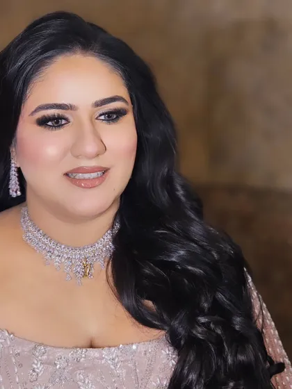 A soft and glamorous engagement look for our bride Anmol. We went with a smokey eye and a glossy nude lip to complement her pastel outfit.
