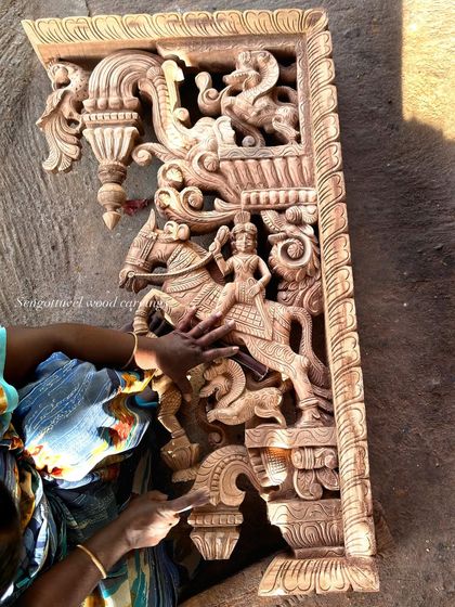 A special 4-foot carving of a horse rider, demonstrating our skill in capturing dynamic scenes. The hands of an artisan are seen giving it a final check.