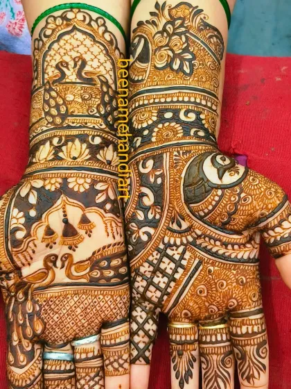 A stunning bridal mehandi with a mix of peacock motifs and intricate patterns. The use of negative space makes the design pop.