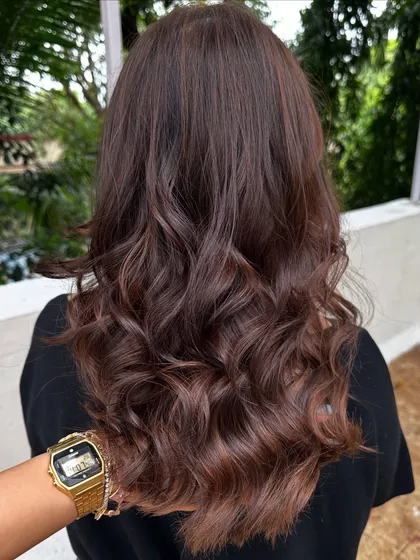 This 'Cinnamon Chocolate' color is perfect for adding warmth and spice to dark hair. The cinnamon tones really pop against the deep chocolate base, especially when styled with waves.