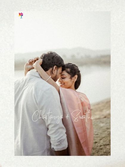 A simple and beautiful portrait with the couple's names elegantly scripted, capturing a tender embrace by the water.