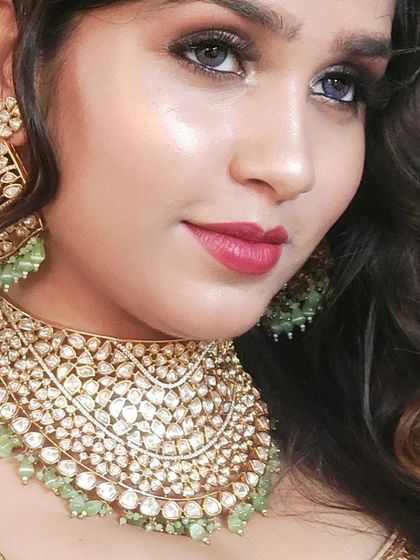 A close-up of a beautiful mint green and Polki choker. The soft color and intricate design make it a perfect choice for a day wedding.