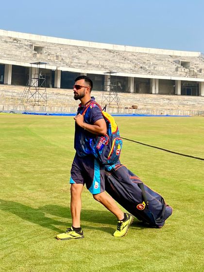 Arriving at the stadium with all the gear, ready for a day of hard work. My training happens where it matters most: on the cricket ground, ensuring every drill is practical and relevant to the game.