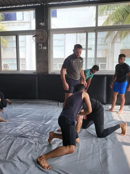 A coach's eye is critical. Here, Dustin observes students as they practice, offering corrections and ensuring the details of the technique are understood correctly.