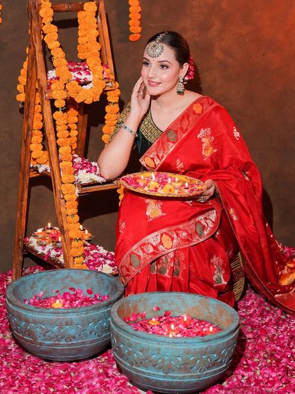 An entire Diwali-themed shoot featuring our red Banarasi saree. This series shows a complete concept, from decor to final look, providing rich inspiration for festive content.