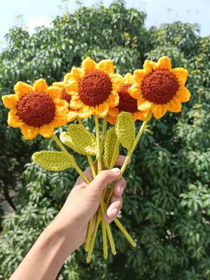 A handful of five bright sunflowers.