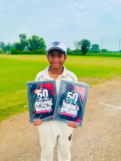 A proud Rudraksh with his two awards for 50 matches and 50 wickets. A fantastic achievement.