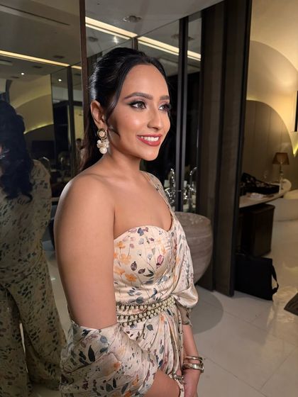 A side profile of this perfect brunch look. The makeup is fresh and radiant, ideal for a daytime celebration like a bridal shower.