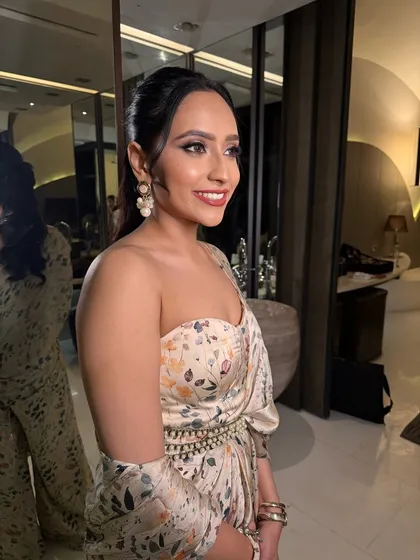 A side profile of this perfect brunch look. The makeup is fresh and radiant, ideal for a daytime celebration like a bridal shower.