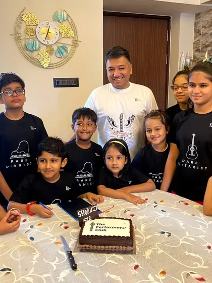 A group photo from our Mumbai student get-together. Our students, wearing their "Born Pianist" and "Born Guitarist" shirts, are the heart of our club.
