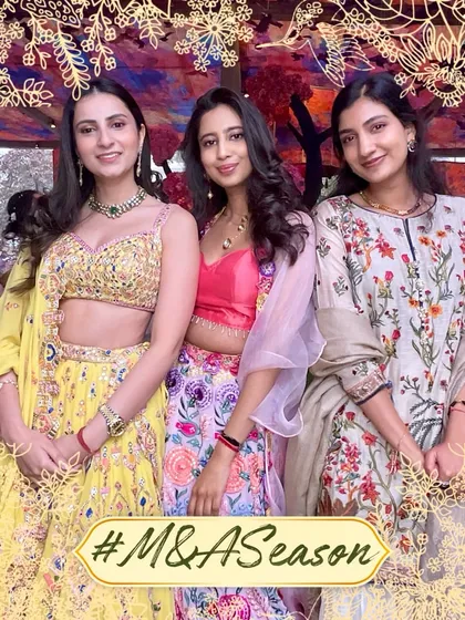 Elegance and grace. Three beautifully dressed guests pose for a picture at the #M&ASeason wedding, framed by our custom floral overlay.