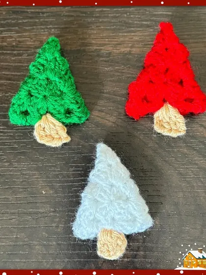 A variety of my Christmas tree brooches, shown here in green, red, and a frosty light blue, offering options to match any holiday outfit.