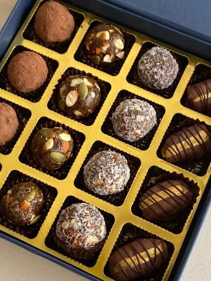A close-up of the all-natural energy bites from my Healthy Bites Hamper, featuring dates, figs, nuts, and seeds.