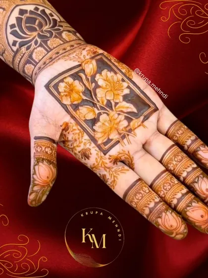 A fancy floral design with a central rectangular panel. The shading on the flowers gives them a realistic, three-dimensional look.
