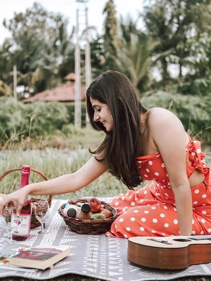 A beautiful solo portrait of the bride-to-be during their picnic-themed pre-wedding shoot. It's a moment of quiet joy and anticipation.