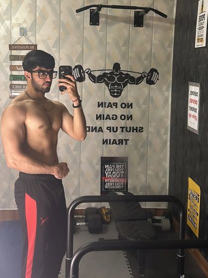 Built with discipline, fueled by passion. The wall says it all: No pain, no gain. Shut up and train.