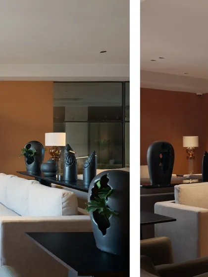A different angle of the Jubilee Headquarters waiting lounge, showing the arrangement of seating and the abstract black sculptures on the console table. Every element is carefully chosen to contribute to the overall aesthetic.