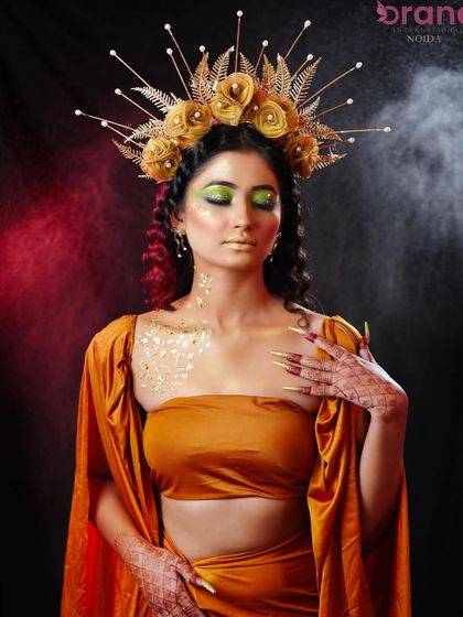 The use of colored smoke in the background adds a mystical and dramatic effect to this fantasy shoot.