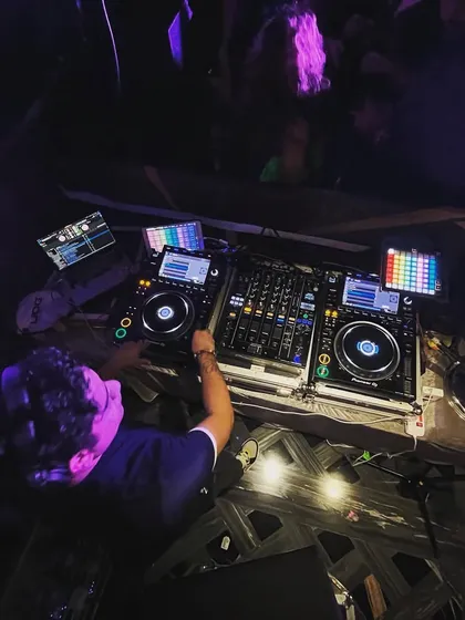 An overhead shot showing my complete setup with dual CDJs. This setup gives me full creative control to mix, scratch, and layer sounds for a truly magical EDM set.