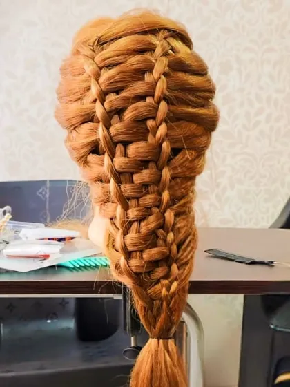 A complex basket-weave braid, a testament to the advanced skills taught and practiced at my academy.