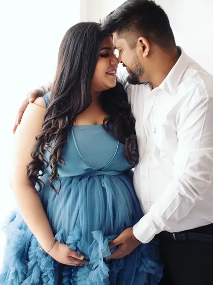 An intimate and romantic close-up. This photo beautifully captures the love and connection between the couple during their maternity session.