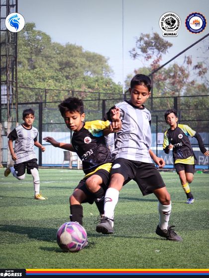 A physical battle for the ball shows the competitive nature of our league. Players learn to be strong and assertive on the pitch.