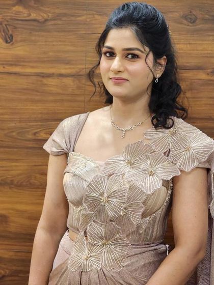 A closer look at the intricate floral details on our modern drape gown. The craftsmanship is designed to make you stand out.