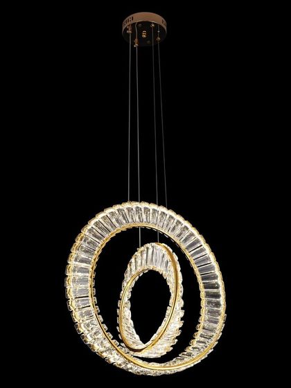 This two-ring crystal pendant light is a perfect example of modern elegance. The intersecting rings create a sense of harmony and movement, providing beautiful illumination for a contemporary home.