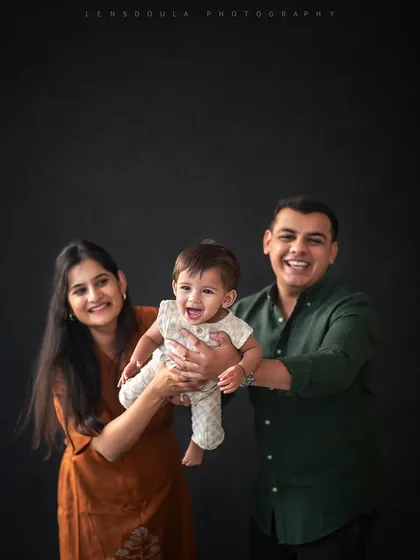 Pure joy! I love capturing the fun, candid moments, like parents playfully lifting their laughing baby. It’s these unscripted interactions that make for the most memorable family photos.