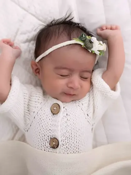 A sleepy smile from a dreaming baby. These are the magical, candid moments I live to capture during a newborn session.