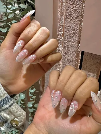 A dreamy, ethereal set with delicate white bows, rhinestones, and a subtle glitter base. Perfect for a magical, romantic look.