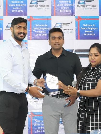 Another shot of Mr. Madhu being presented with the 'Extra Miles' award. It's important for us to recognize those who put in the extra effort.