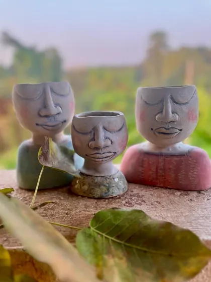 A small family of custom planters I made for a client. Each one is hand-sculpted with its own peaceful expression, designed to bring a little bit of calm and nature into your home.