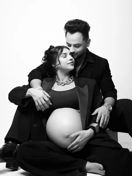 A powerful and chic portrait with Pria Beniwal and Millind Gaba. This black and white shot highlights the modern, edgy style we can explore in your maternity shoot.