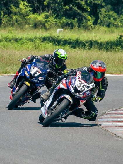 Close racing action between two riders at MMRT, both fighting for the same piece of tarmac. This is what competition is all about.