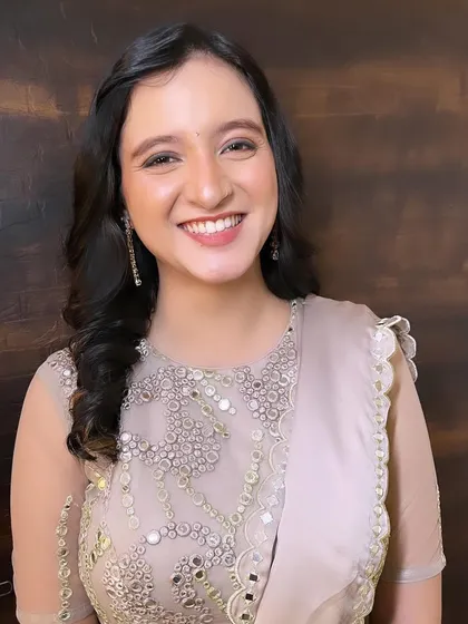 A soft and elegant look for a special day. The makeup is minimal yet polished, with a focus on enhancing her natural features.
