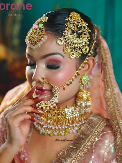 This shot focuses on the delicate details of the jewelry and the soft, blended eyeshadow.