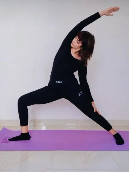 The Extended Side Angle Pose (Utthita Parsvakonasana) is a foundational standing pose that stretches the entire side of the body, from the heel to the fingertips. It builds strength in the legs while improving torso flexibility.
