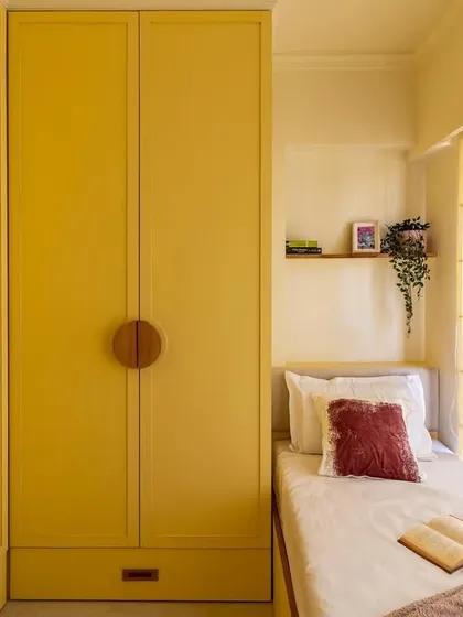 Your home should reflect your personality. We loved bringing this client's vision to life with a bold monochrome yellow bedroom, proving that even small spaces can be filled with vibrant character and clever design.