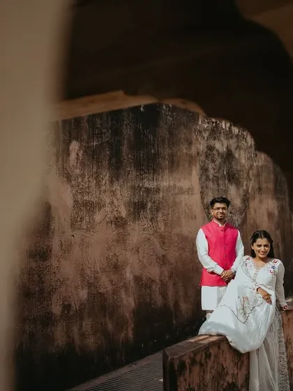 Using shadows and light within the fort's corridors, we created this beautifully composed, intimate portrait. This is an example of our fine-art approach to couple photography, finding art in unexpected corners.